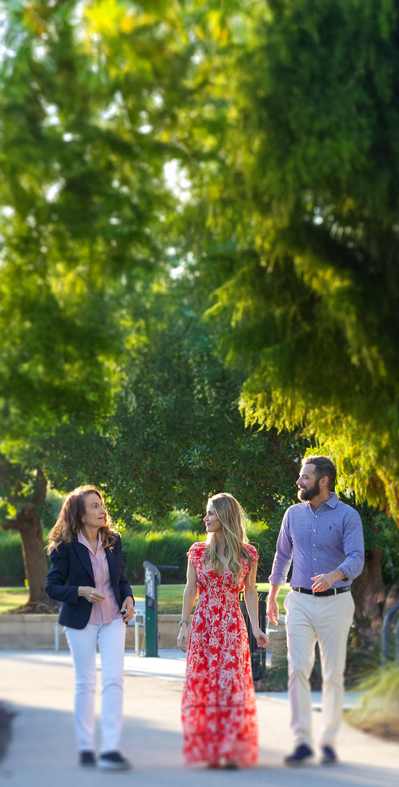 Penny Taylor talking with a couple in a park