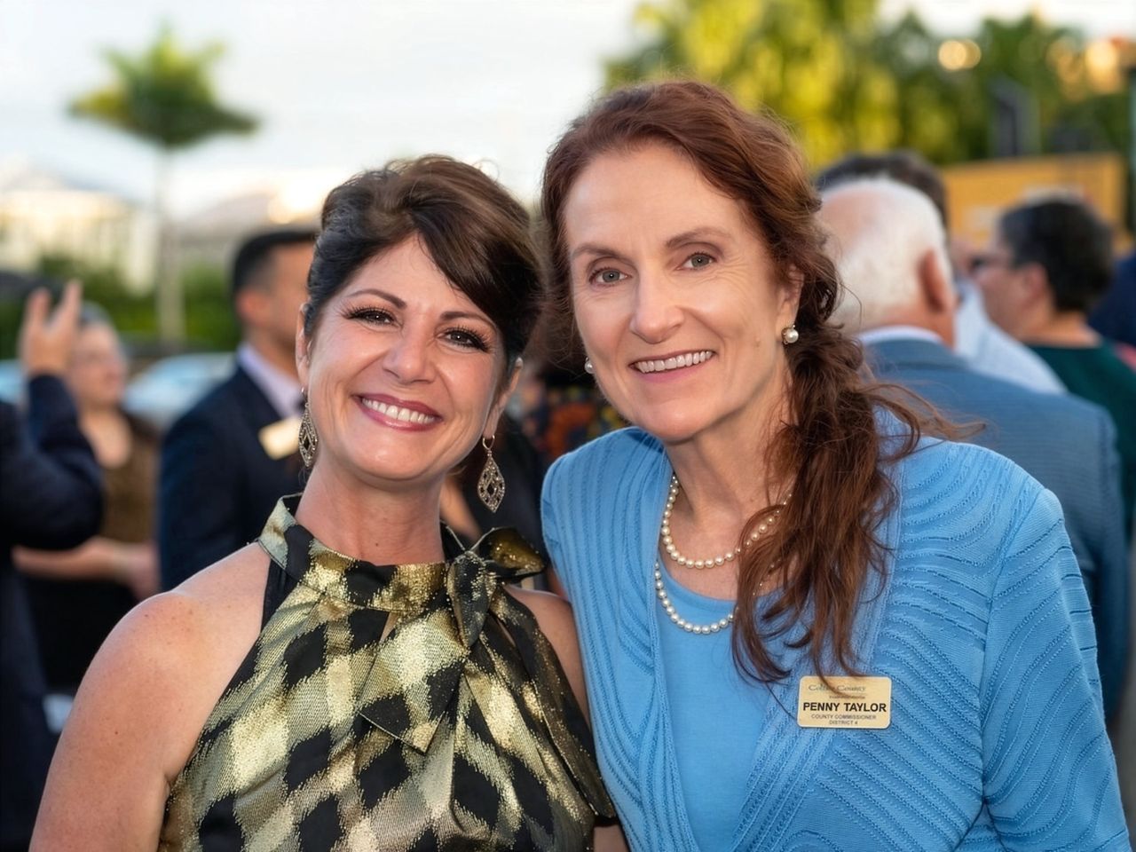 Penny Taylor smiling with a group of people